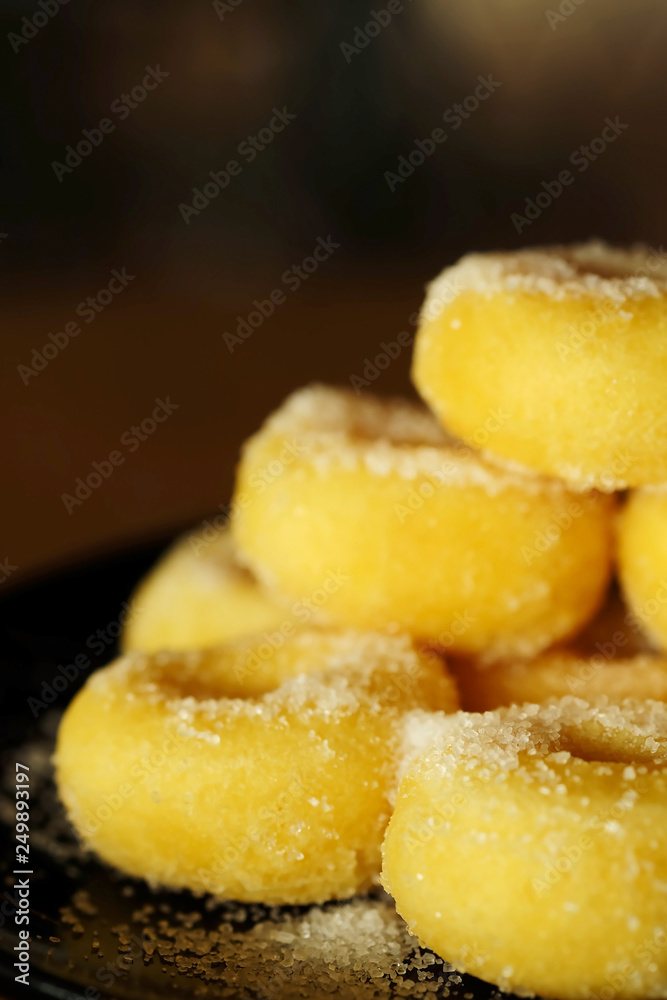 Fried donut with sugar, popular sweet sold in market or restaurant, high calories, sugar and cholesterol level cause of many chronic disease such as diabetes and heart disease affect economic problem Fried donut with sugar, popular sweet sold in market or restaurant, high calories, sugar and cholesterol level cause of many chronic disease such as diabetes and heart disease affect economic problem