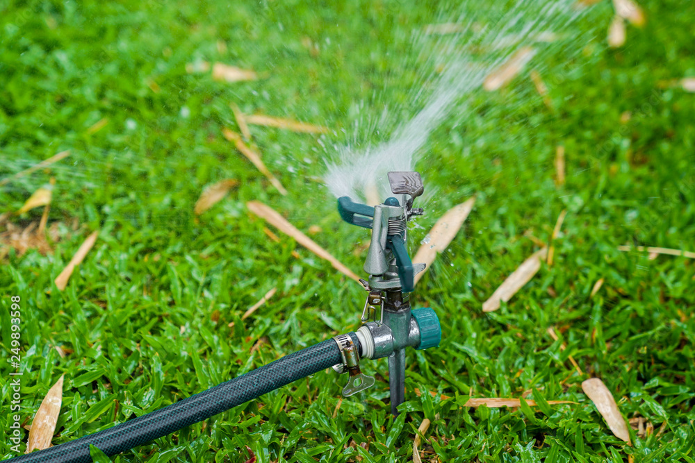 sprinkle splashing water on grass sprinkle splashing water on grass