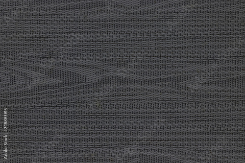 Dark fabric texture background. Stripes and lines from the material.