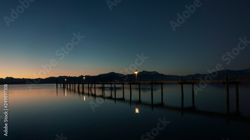 old wooden pier at sunrise © pixelleo