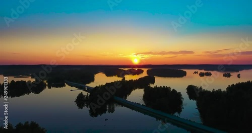 Aerial view of calm lake at orange sunset photo
