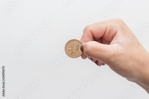 woman hand holding 1 dollar coin from Sacagawea photo