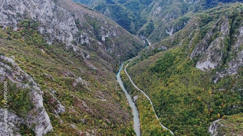 Canyon of the river Tara in Montenegro with a bird's-eye.Drone flies between the mountains along the road and the river. Dzhurdzhevich Bridge photo