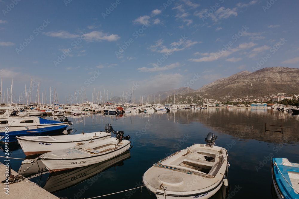 Bar, Montenegro - November 31, 2018. fishing boats on the background of mountains and yachts on the Adriatic coast. - Image.