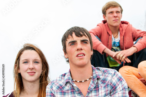 group of teenagers looking away outdoors © potstock