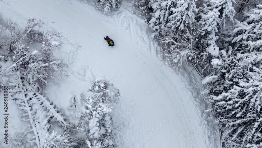 Sledding on a snowy road filmed with drone Sledding on a snowy road filmed with drone