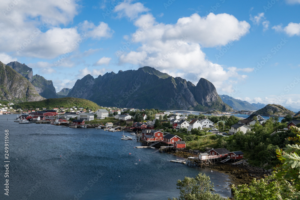Dramatic view of Lofoten Islands Norway landscape view of fishing village with blue sky, mountains and water. 