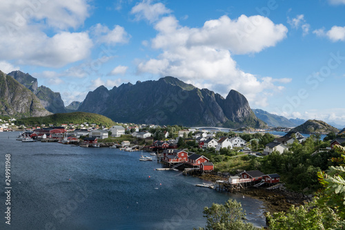 Dramatic view of Lofoten Islands Norway landscape view of fishing village with blue sky, mountains and water. 