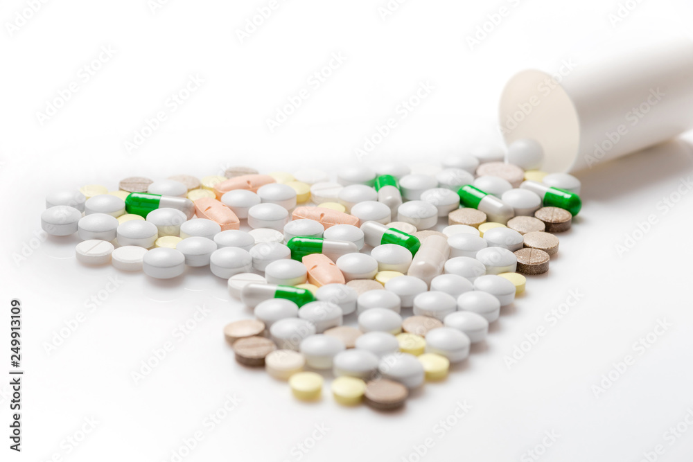 Pills mix in a heart shape.