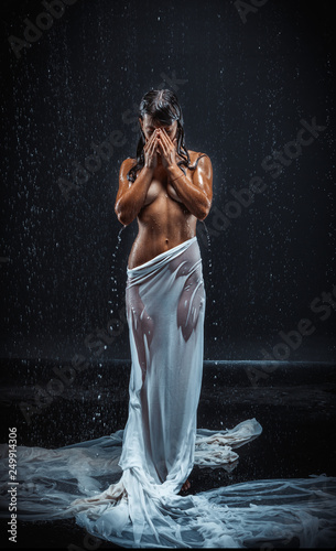 beautiful nude woman in aqua in the rain