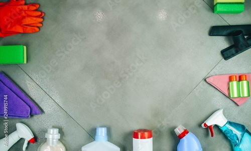 Cleaning products on the tile. House cleaning concept. View from above. Place for a logo lettering