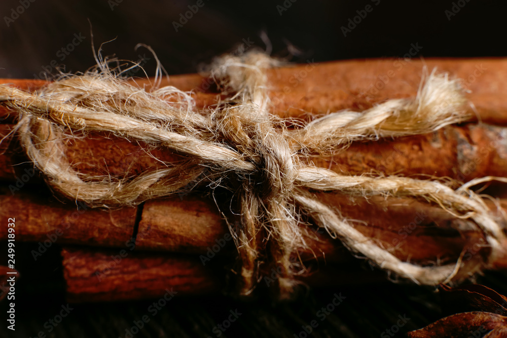 Spices sticks cinnamon on the old table. Rustic background, aroma close-up. Spices sticks cinnamon on the old table. Rustic background, aroma close-up.