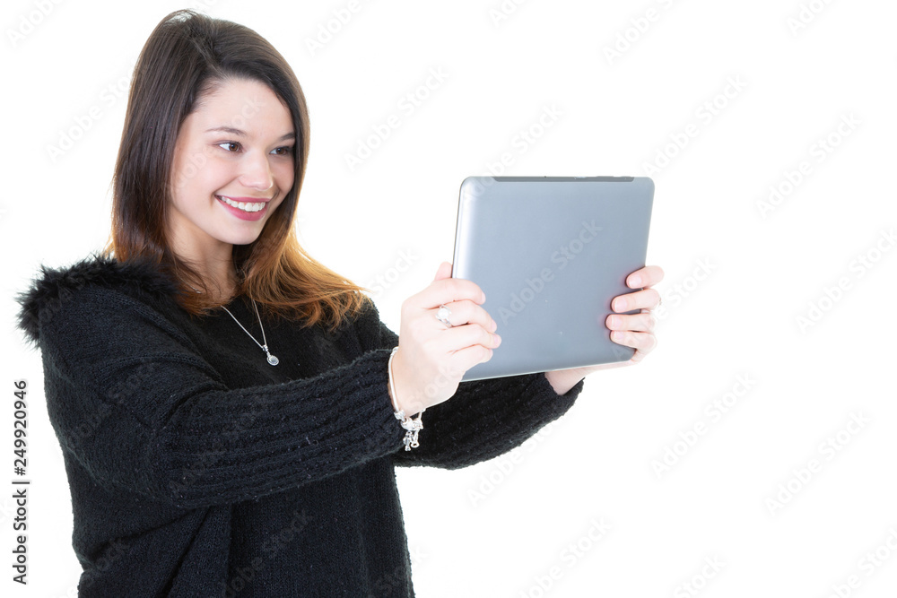 Funny young girl with digital tablet isolated on white background Funny young girl with digital tablet isolated on white background