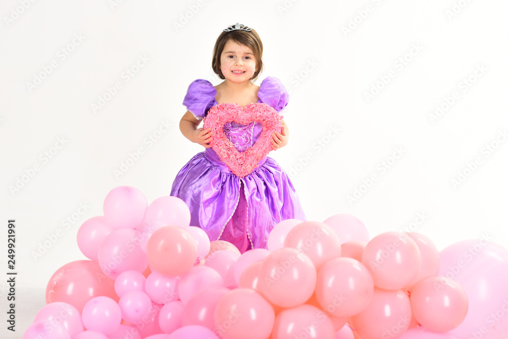 Party balloons. Valentines day. Happy birthday. Kid fashion. Little miss in beautiful dress. Childhood and happiness. Childrens day. Small pretty child hold heart. Little girl princess. True love Party balloons. Valentines day. Happy birthday. Kid fashion. Little miss in beautiful dress. Childhood and happiness. Childrens day. Small pretty child hold heart. Little girl princess. True love