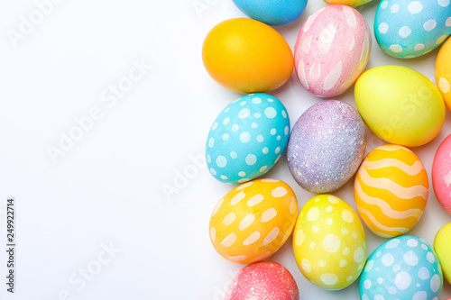 Decorative Easter eggs on white background, space for text. Top view