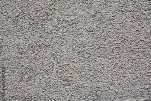 Grainy grey wall perfect for texture. Textured weathered rough surface for background. Abstract architectural backdrop. 