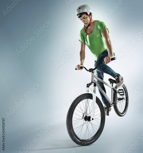 Extreme Sport. Boy jumping with his street-bike.