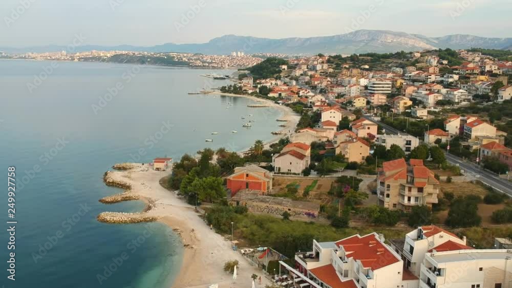 Seafront view at west village near old city Split town, Dalmatian coast place view from the Adriatic Sea, Croatia. Coast line of hotels for tourist, quite and comfortable vacation location. Seafront view at west village near old city Split town, Dalmatian coast place view from the Adriatic Sea, Croatia. Coast line of hotels for tourist, quite and comfortable vacation location.