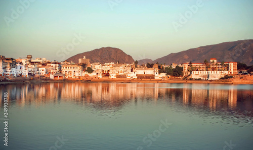 Natural color blue over indian city Pushkar, holy lake, hills. Cityscape at evenng time with beautiful scene in India