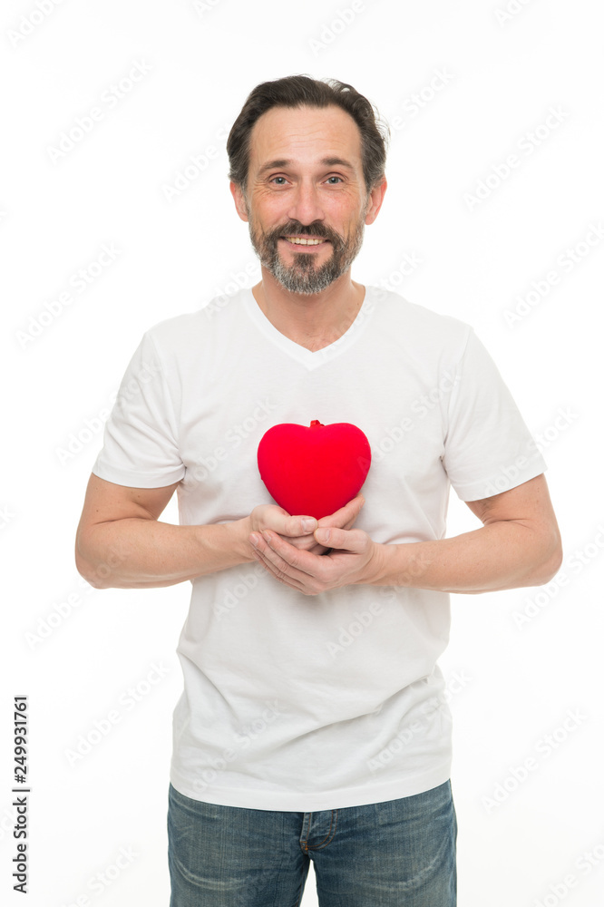 Romantic and affectious. Handsome mature man with valentines day heart. Valentines man holding red toy heart in hands. Heart problem and healthcare. Preventing heart attack Romantic and affectious. Handsome mature man with valentines day heart. Valentines man holding red toy heart in hands. Heart problem and healthcare. Preventing heart attack
