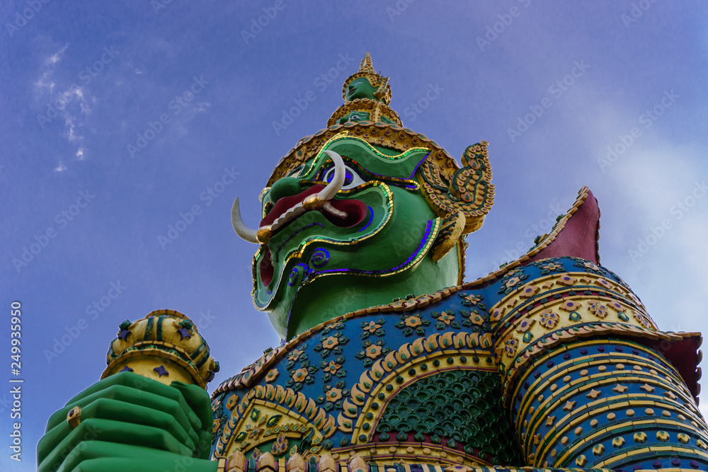 Statue of Giant at Wat Arun. Wat Arun or Temple of the Dawn is one of a famous Buddhist temple in the Bangkok, Thailand Statue of Giant at Wat Arun. Wat Arun or Temple of the Dawn is one of a famous Buddhist temple in the Bangkok, Thailand