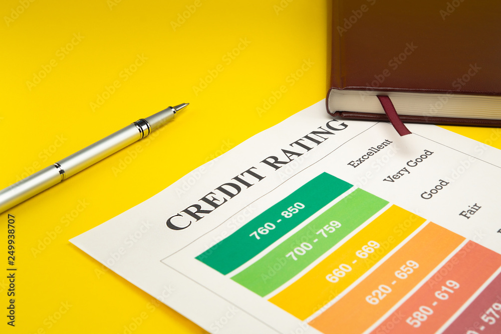 Credit rating on a yellow table, pen, notebook. Credit rating on a yellow table, pen, notebook.