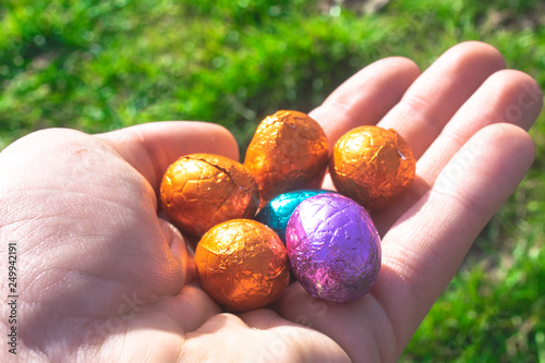 Colorful Easter Eggs Lie In Hand