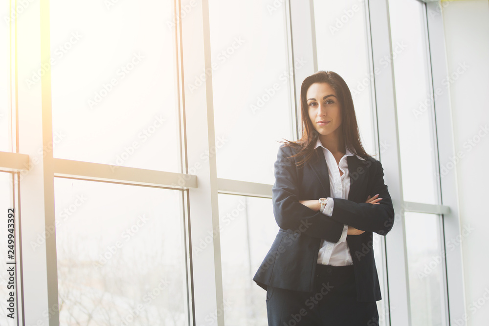 Young businesswoman sitting at workplace and reading paper in office Young businesswoman sitting at workplace and reading paper in office