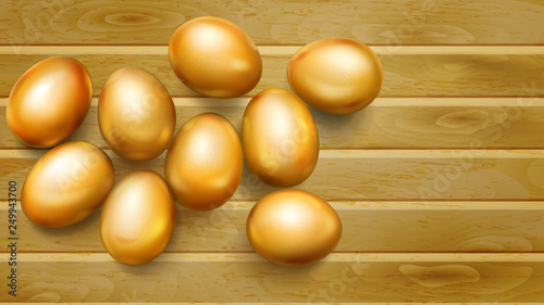 Realistic golden Easter eggs with shadows on wooden planks
