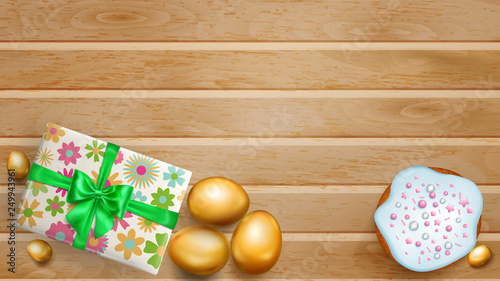 Realistic golden Easter eggs, tasty cake and beautiful gift box with bow on wooden planks