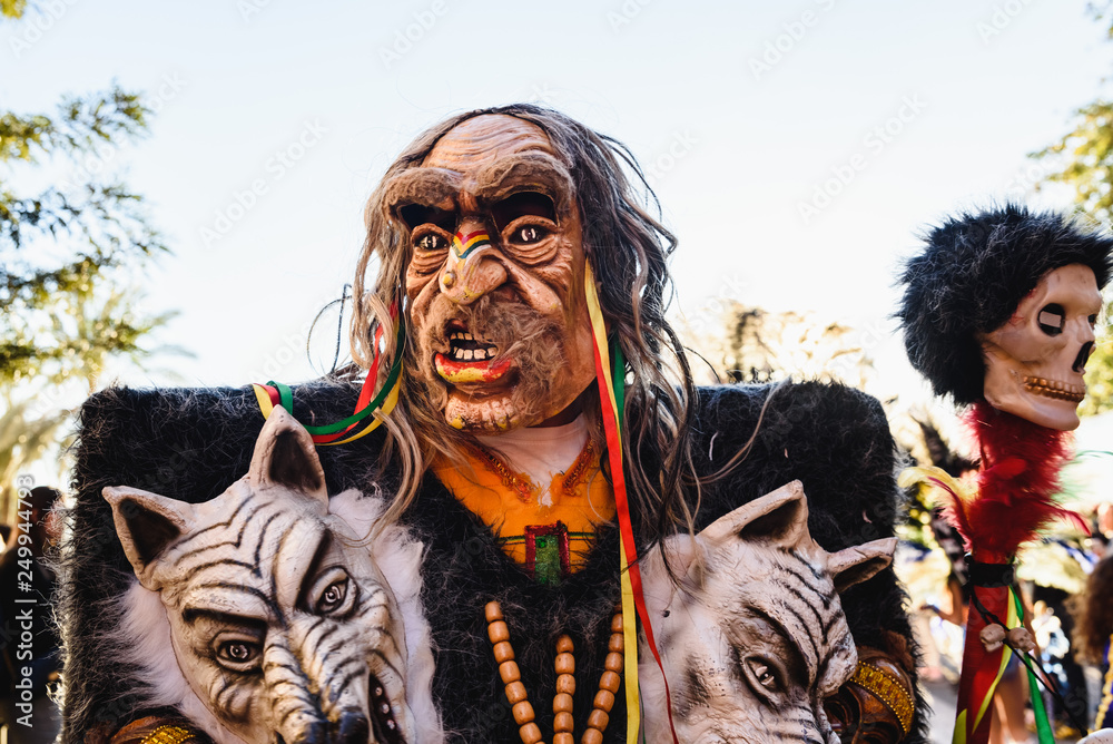 Valencia, Spain - February 16, 2019: Man disguised as a shaman, traditional wizard of Peru.