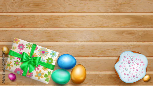Realistic colored Easter eggs, tasty cake and beautiful gift box with bow on wooden planks