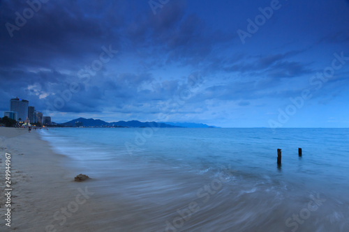  sandy beach at night in blue tones photographed on long exposure photo