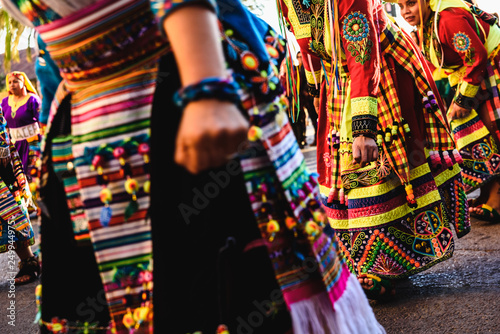 Valencia, Spain - February 16, 2019: Detail of the colorful traditional Bolivian party outfit during a carnival parade showing folklore typical of Latin countries with dancing dancers.