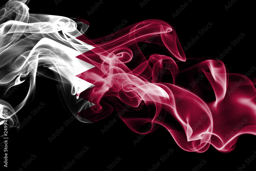 National flag of Qatar made from colored smoke isolated on black background. Abstract silky wave background. National flag of Qatar made from colored smoke isolated on black background. Abstract silky wave background.
