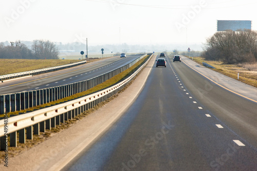 car highway leaving into the distance