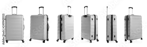 Set of stylish light suitcase for travelling on white background photo