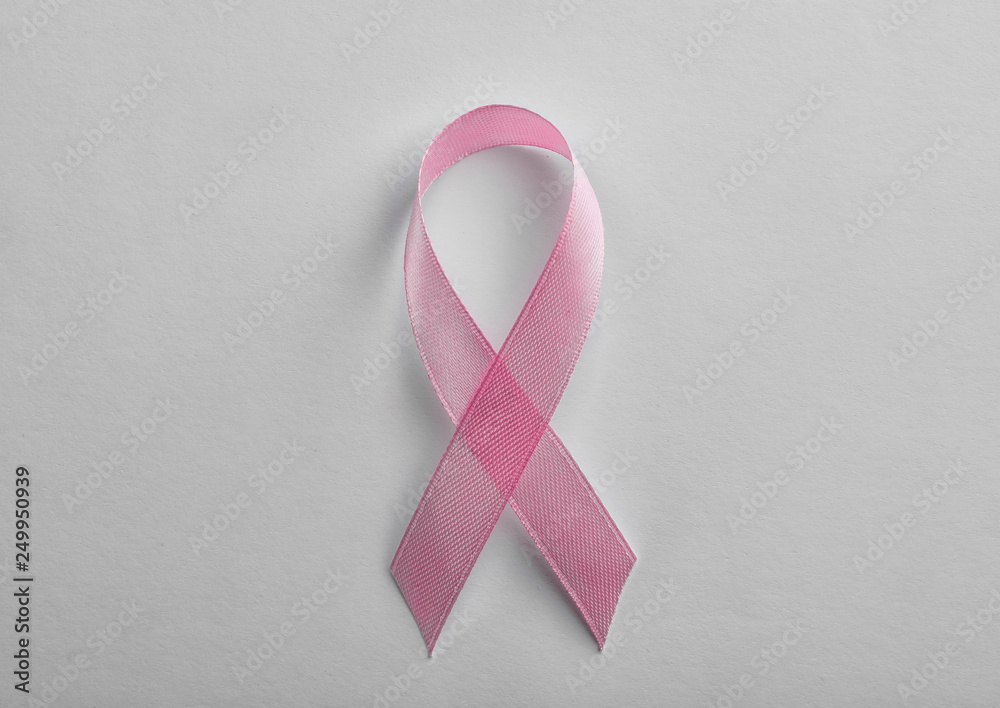 Pink ribbon on white background, top view. Breast cancer awareness concept Pink ribbon on white background, top view. Breast cancer awareness concept