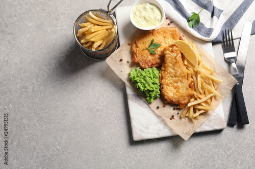 British traditional fish and potato chips on table, top view with space for text