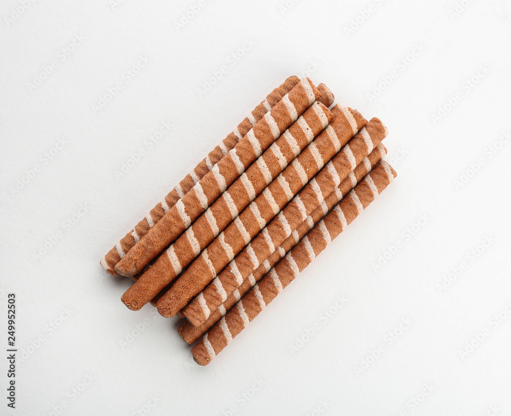 Delicious chocolate wafer rolls on white background, top view. Sweet food Delicious chocolate wafer rolls on white background, top view. Sweet food