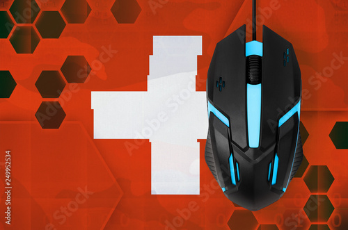 Switzerland flag  and computer mouse. Concept of country representing e-sports team