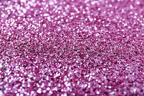 Texture of rose gold glitter as background, closeup