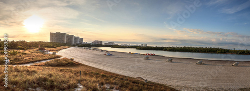 Sunrise over the highrise buildings at Tigertail Beach on Marco Island photo