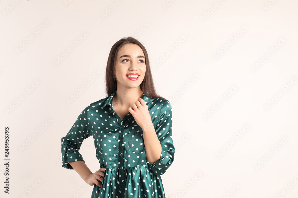 Portrait of beautiful young woman in stylish dress on white background. Space for text Portrait of beautiful young woman in stylish dress on white background. Space for text