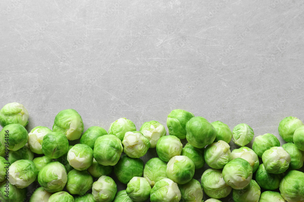 Fresh Brussels sprouts on grey background, top view with space for text Fresh Brussels sprouts on grey background, top view with space for text