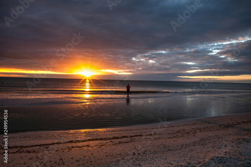 Man fishes along Tigertail Beach at sunset on Marco Island photo