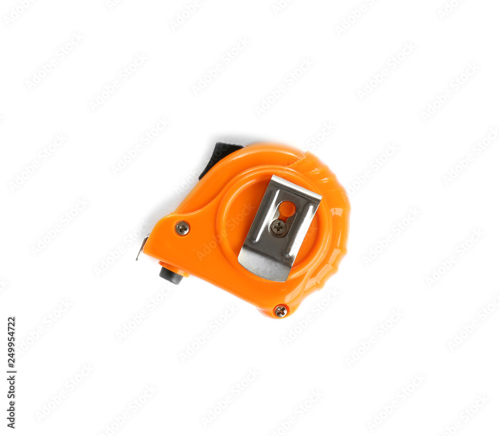 New measuring tape on white background, top view. Construction tools