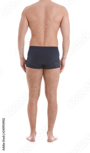 Young athletic man on white background, closeup. Weight loss