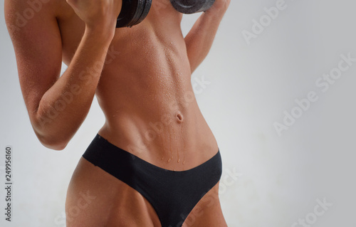 Six pack abs. Fitness and attractive girl. Girl with a perfect body. Sport, fitness, weight loss. Fitness woman.