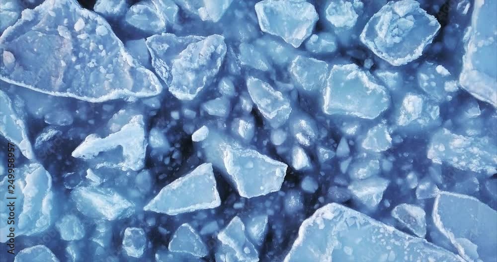 Static top aerial view of moving arctic ice floes